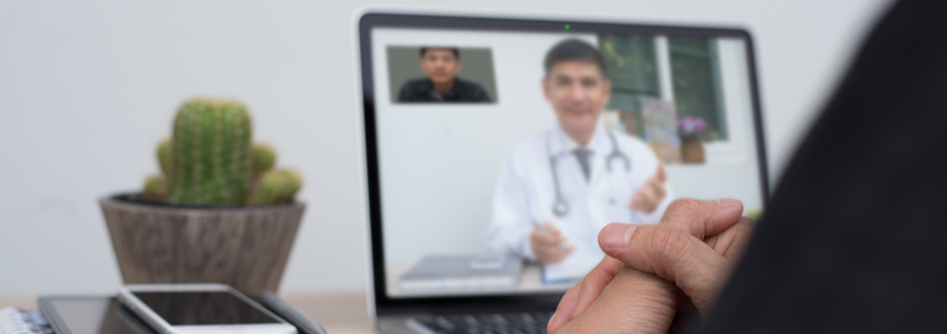 Person having a virtual meeting with a doctor