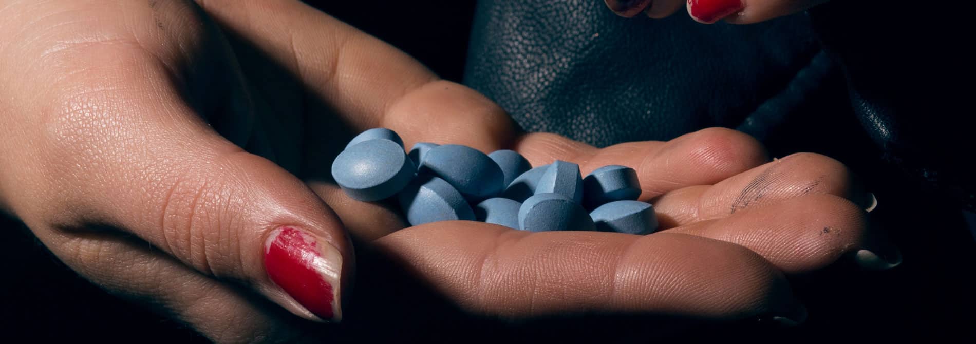 Woman holding xanax pills