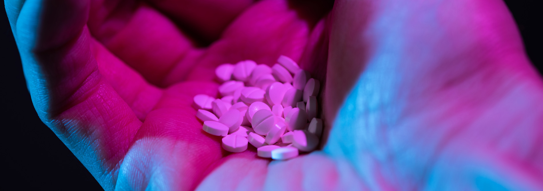 close up of hand with pills