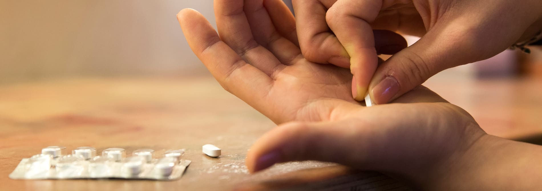 Woman with a pill in her hand