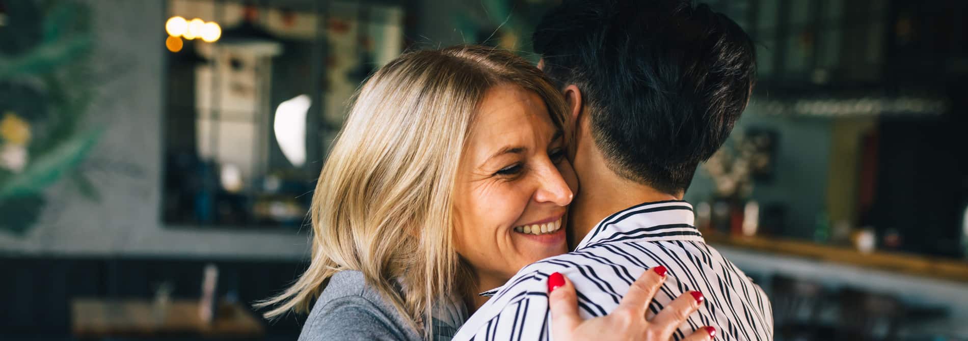 Happy woman hugging their child