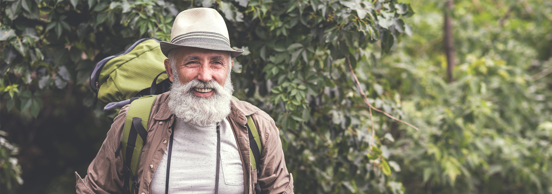 Happy older man hiking