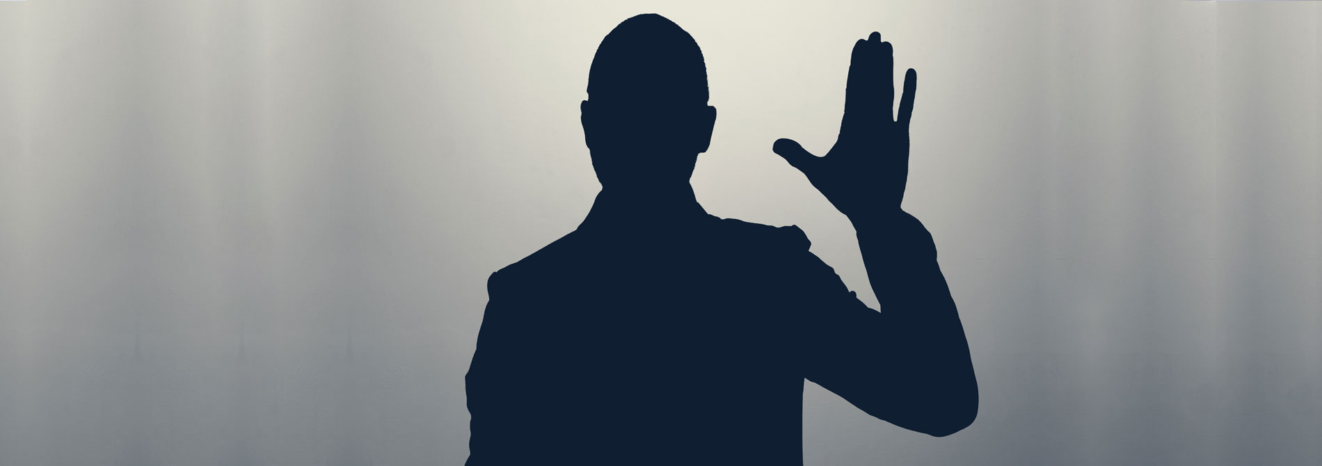 silhouette of man waving