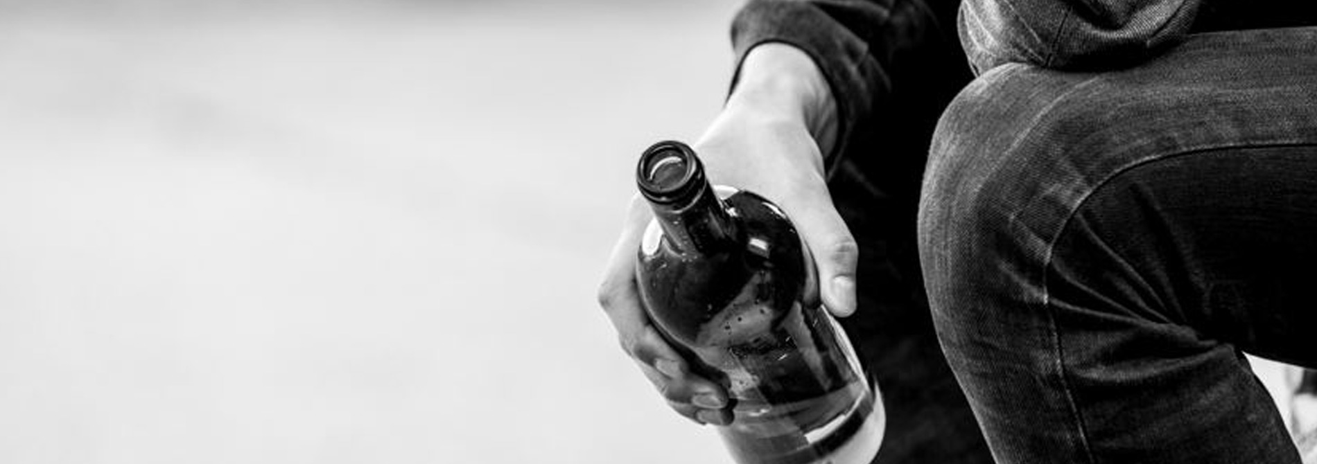 Man holding alcohol bottle