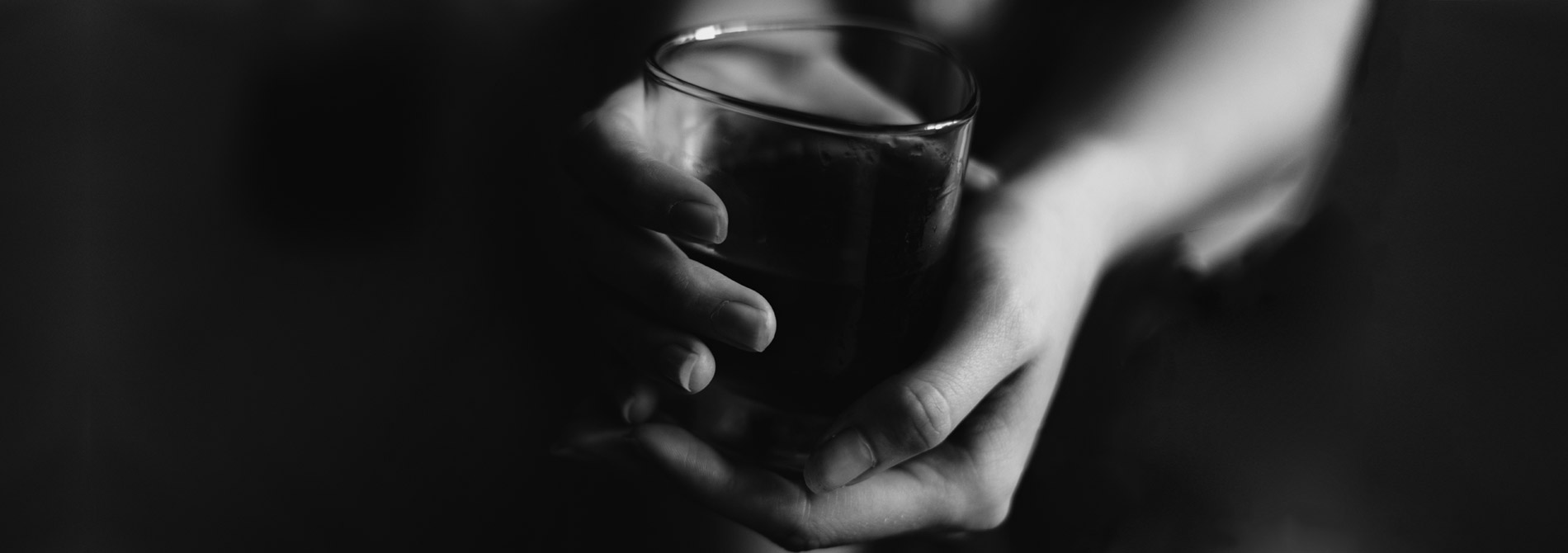 woman's hands holding a drink